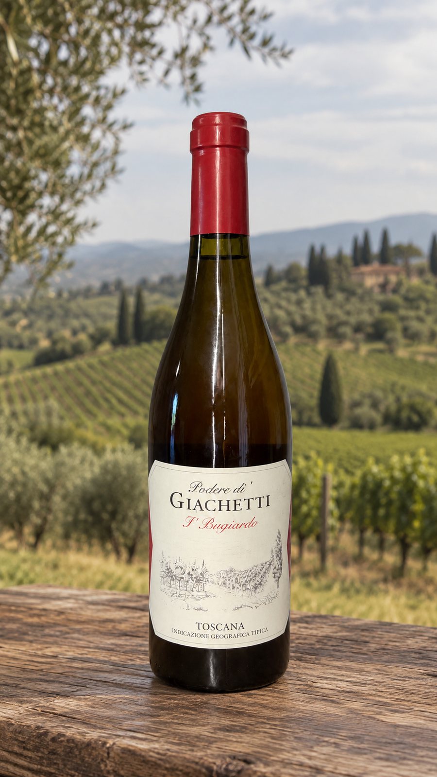 A bottle of I' Bugiardo on a wooden table, vineyards behind