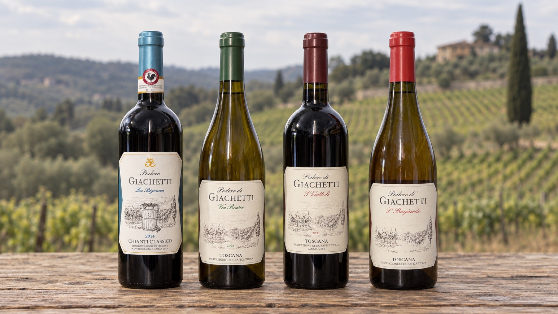 The four bottles of Podere di' Giachetti in a row on a wooden table, with the Chianti vineyards behind